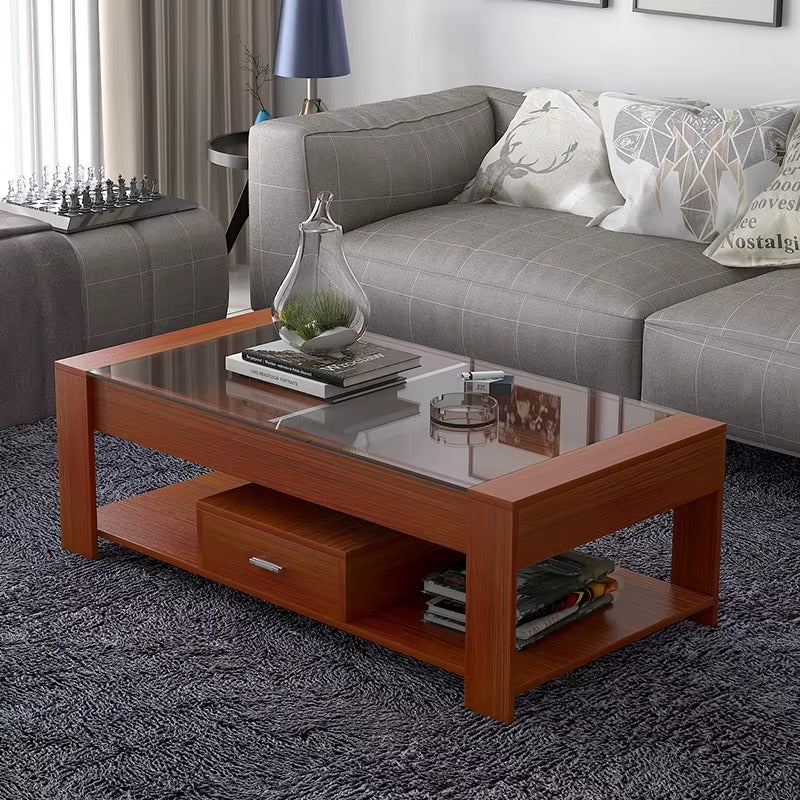 Table basse moderne rectangulaire de 120x60cm avec plateau en verre noir, structure blanche, tiroir de rangement et étagère inférieure, disponible chez 236 Shopping Bangui.